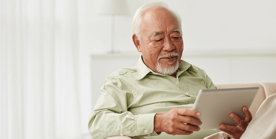 man reading on ipad