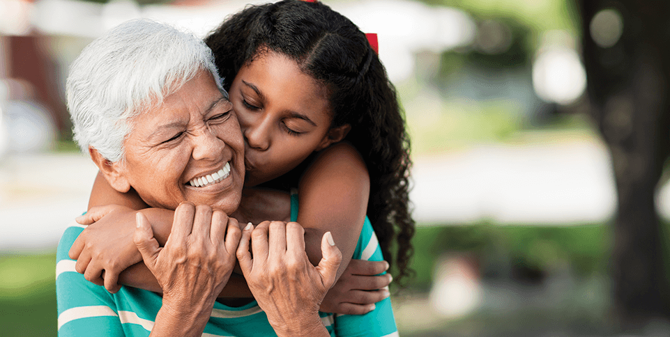 woman hugging granddaughter