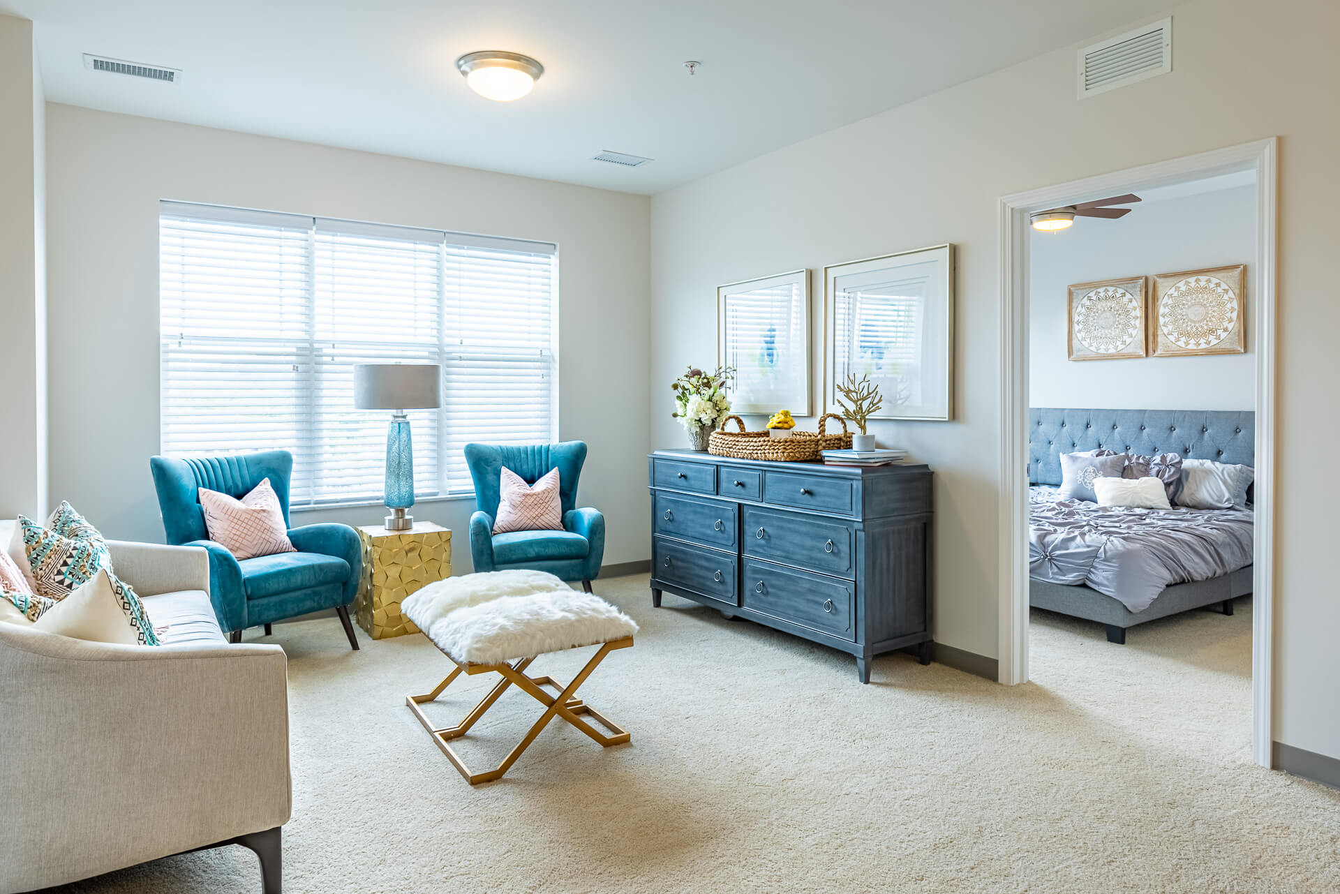 Ryan_BellevuePlace_Nashville_DavidKeith-441-HDR 2 blue dresser and chairs next to a couch in a well lit living room